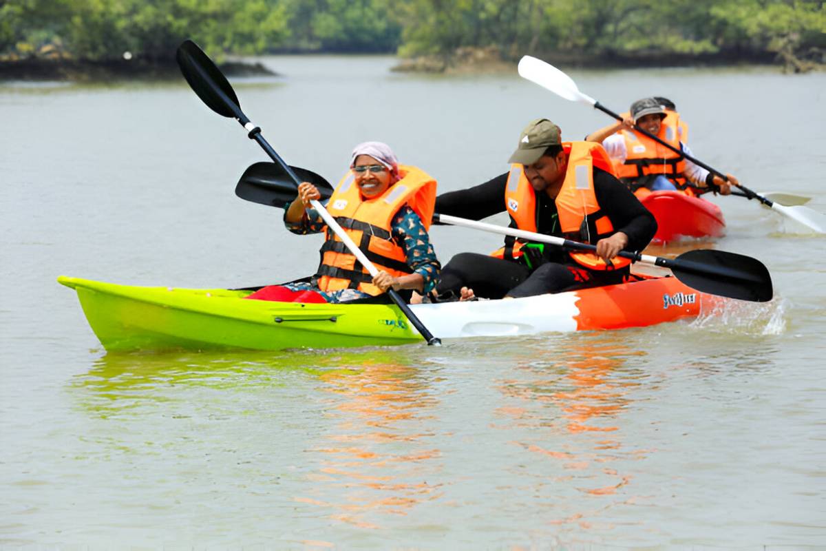 A woman and a man riding a kayak