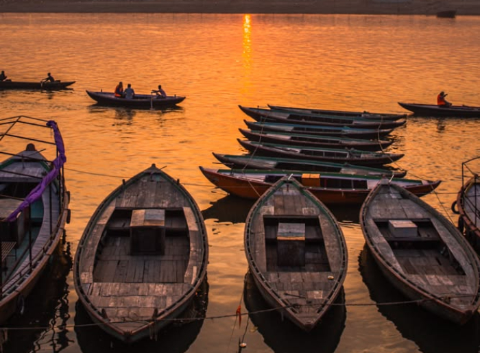 Travelers exploring the historic ghats of Varanasi along the Ganges during a three-day Varanasi itinerary