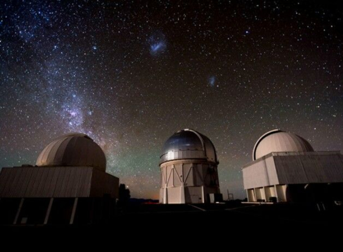  Milky Way visible over a dark desert landscape