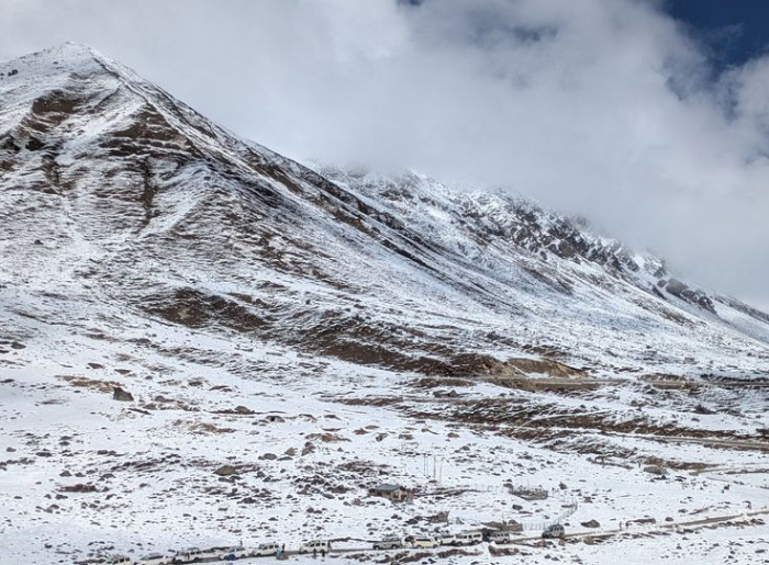 Zero Point in North Sikkim surrounded by snow-covered Himalayan mountains