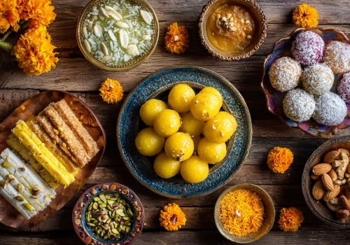 Traditional Punjabi sweets including Pinni, Panjiri, Phirni, and Dodha Barfi